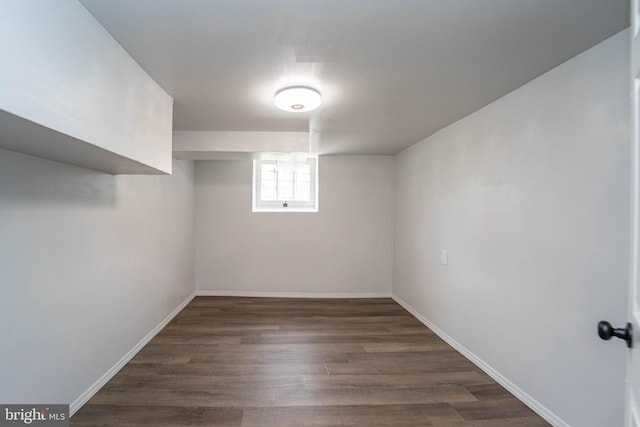 3232 N Rolling Rd, Baltimore, MD 21244 - below grade area with dark wood-style floors and baseboards