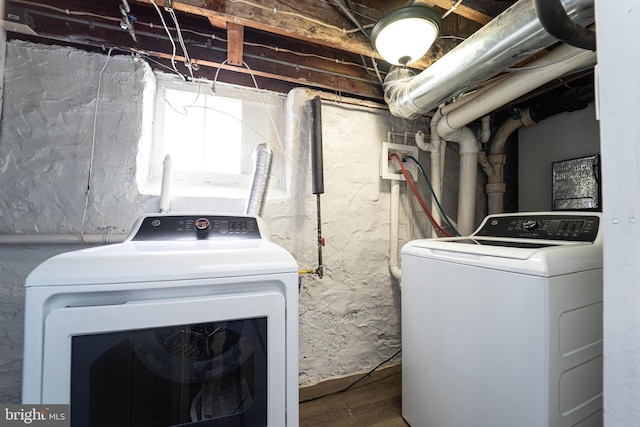3232 N Rolling Rd, Baltimore, MD 21244 - laundry area with washer and dryer and wood finished floors