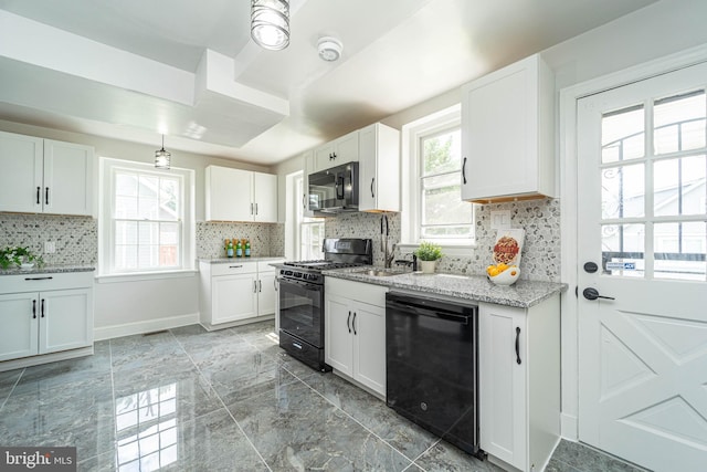 3232 N Rolling Rd, Baltimore, MD 21244 - kitchen with black appliances, tasteful backsplash, white cabinets, light stone countertops, and light marble finish floors