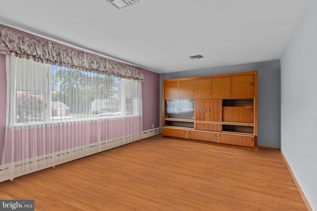 645 Lily Rd, Warminster, PA 18974 - unfurnished living room featuring light wood-style flooring, baseboards, and baseboard heating
