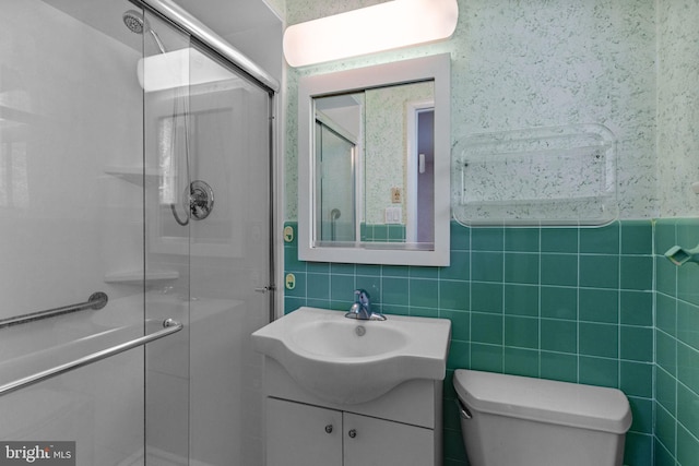 645 Lily Rd, Warminster, PA 18974 - bathroom with vanity, tile walls, a shower stall, and toilet