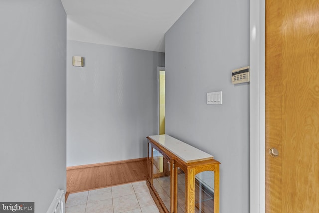 645 Lily Rd, Warminster, PA 18974 - hallway with light tile patterned floors and baseboard heating