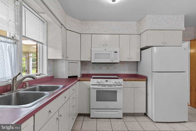 645 Lily Rd, Warminster, PA 18974 - kitchen with white appliances, a sink, light tile patterned floors, and white cabinets