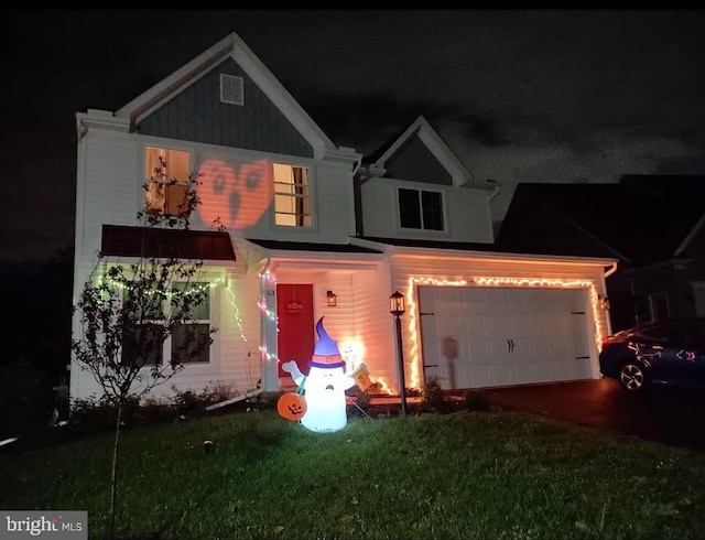 53 Shelduck Ln, Mechanicsburg, PA 17050 - view of front of home featuring driveway, an attached garage, and a lawn