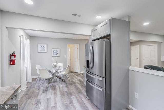 136 Pemberton Browns Mill Rd, Browns Mills, NJ 08015 - kitchen with stainless steel fridge, light wood-type flooring, recessed lighting, baseboards, and light countertops