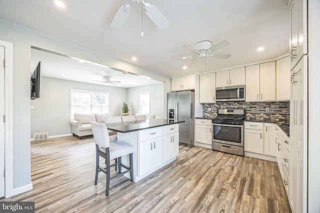 17 S Jefferson Ave, National Park, NJ 08063 - kitchen with stainless steel appliances, ceiling fan, dark countertops, light wood finished floors, and recessed lighting