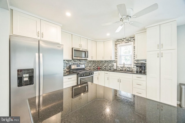 17 S Jefferson Ave, National Park, NJ 08063 - kitchen with stainless steel appliances, a sink, ceiling fan, backsplash, and white cabinets