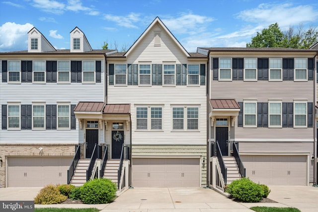 468 Rowan St, Warminster, PA 18974 - multi unit property featuring concrete driveway, an attached garage, a standing seam roof, and metal roof