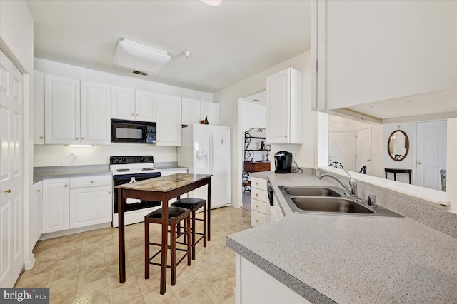 7 Brook Farm Ct Unit 7E, Perry Hall, MD 21128 - kitchen with electric stove, black microwave, white refrigerator with ice dispenser, a sink, and white cabinetry