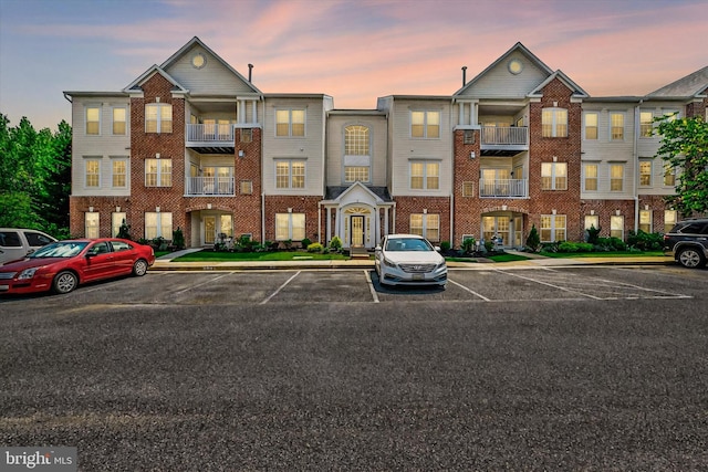 7 Brook Farm Ct Unit 7E, Perry Hall, MD 21128 - property at dusk featuring uncovered parking