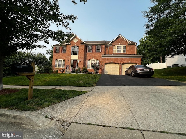 6810 Ashleys Crossing Ct, Temple Hills, MD 20748 - view of front of property with brick siding, an attached garage, and driveway