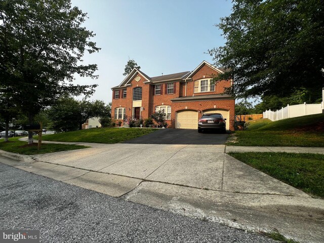 6810 Ashleys Crossing Ct, Temple Hills, MD 20748 - view of front facade with brick siding, driveway, and a garage