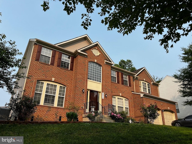 6810 Ashleys Crossing Ct, Temple Hills, MD 20748 - view of front of property featuring brick siding, a garage, and a front yard