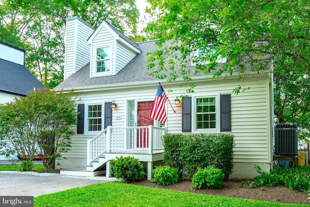 1414 Ellis Rd, Annapolis, MD 21403 - cape cod-style house with cooling unit, a chimney, and roof with shingles