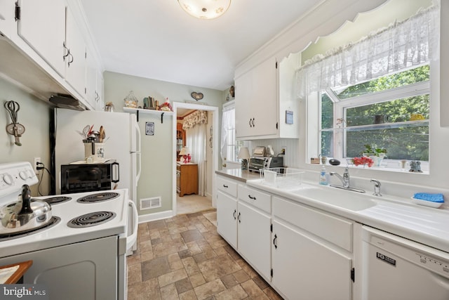 39 Stoney Run Rd, Wilmington, DE 19809 - kitchen featuring white appliances, stone finish flooring, white cabinets, and light countertops