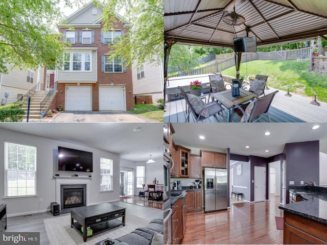 3317 Eagle Ridge Dr, Woodbridge, VA 22191 - living room featuring wood finished floors, a towering ceiling, a glass covered fireplace, and baseboards