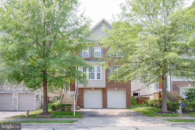 3317 Eagle Ridge Dr, Woodbridge, VA 22191 - view of front of property with asphalt driveway, stairs, and an attached garage