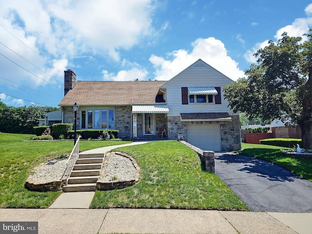 1927 N 15th St, Reading, PA 19604 - tri-level home with stone siding, a front yard, and asphalt driveway