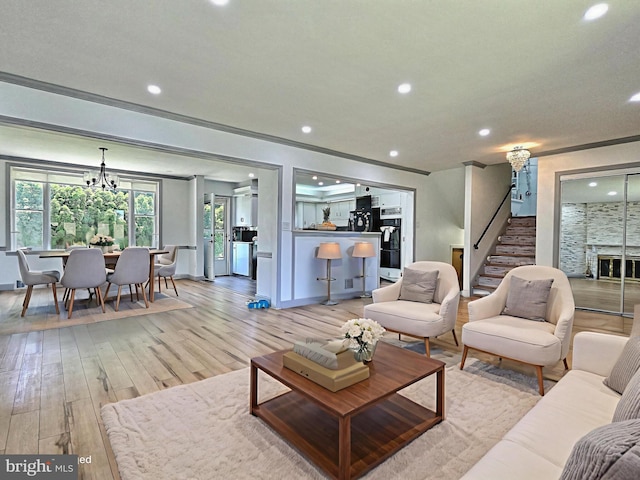 1927 N 15th St, Reading, PA 19604 - living room featuring stairs, recessed lighting, light wood-style floors, a chandelier, and baseboards