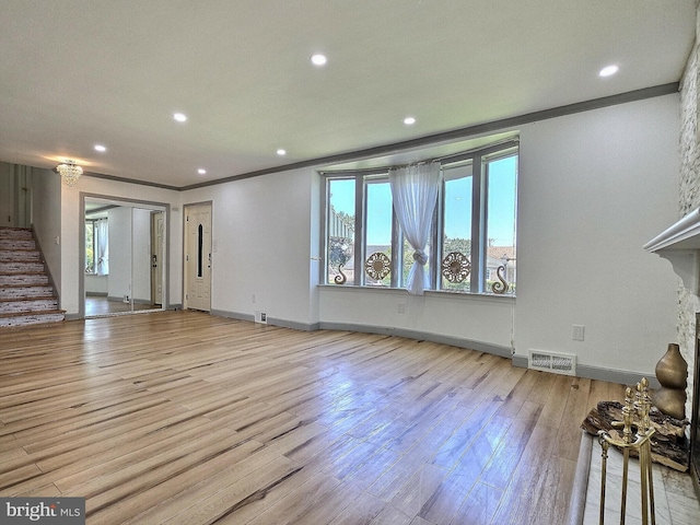 1927 N 15th St, Reading, PA 19604 - unfurnished living room featuring wood finished floors, recessed lighting, ornamental molding, stairs, and baseboards