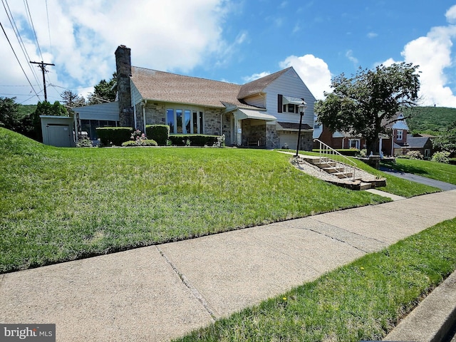 1927 N 15th St, Reading, PA 19604 - view of front facade with stone siding, a front yard, and a chimney