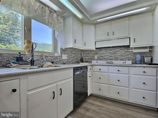 1927 N 15th St, Reading, PA 19604 - kitchen with black dishwasher, cooktop, tasteful backsplash, a sink, and light countertops