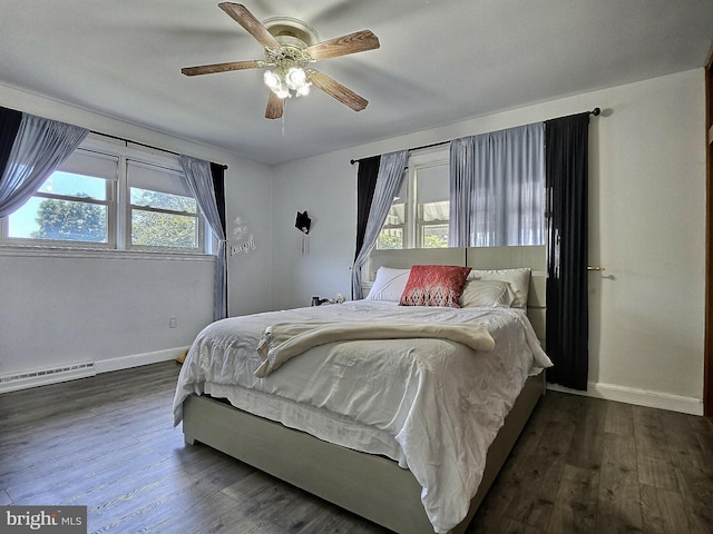 1927 N 15th St, Reading, PA 19604 - bedroom featuring a baseboard heating unit, baseboards, and wood finished floors