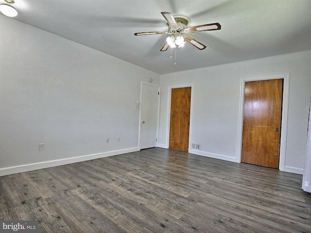 1927 N 15th St, Reading, PA 19604 - unfurnished bedroom with dark wood-style flooring, baseboards, and a ceiling fan