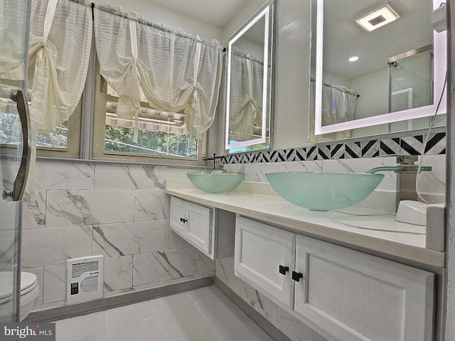 1927 N 15th St, Reading, PA 19604 - full bath featuring double vanity, toilet, tile patterned flooring, and a shower with shower curtain