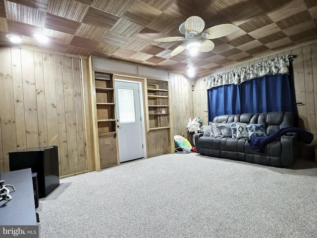 1927 N 15th St, Reading, PA 19604 - carpeted living area featuring wooden walls, a ceiling fan, and built in features