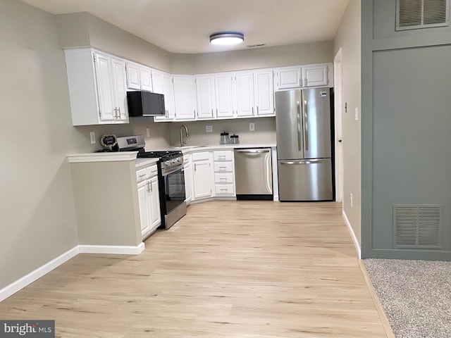 6 Kent Pl, Sewell, NJ 08080 - kitchen featuring appliances with stainless steel finishes, baseboards, and white cabinets