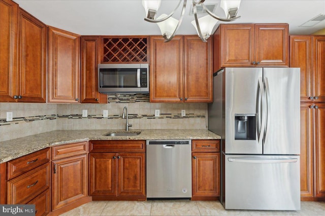 302 Berkshire, Princeton, NJ 08540 - kitchen featuring stainless steel appliances, light stone countertops, a chandelier, and backsplash