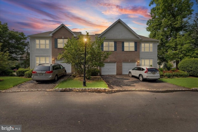 302 Berkshire, Princeton, NJ 08540 - traditional-style house with driveway, a garage, brick siding, and a lawn