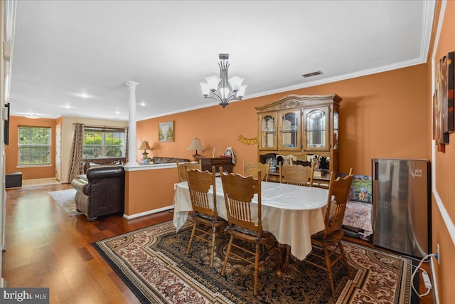 302 Berkshire, Princeton, NJ 08540 - dining room featuring ornamental molding, a chandelier, wood finished floors, and decorative columns