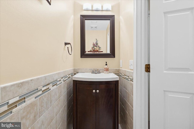 302 Berkshire, Princeton, NJ 08540 - half bathroom featuring tile walls, vanity, and wainscoting