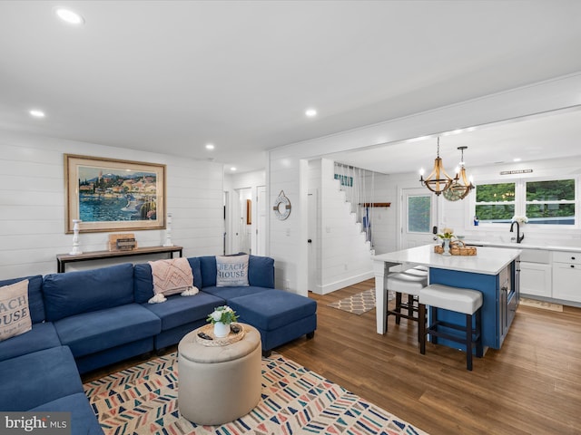 65 W W Ave W, Ocean View, DE 19970 - living area featuring stairway, wood finished floors, a chandelier, recessed lighting, and wooden walls