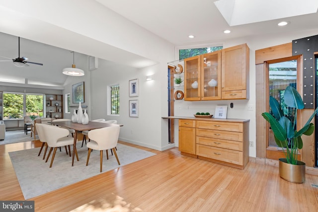 4834 8th St S, Arlington, VA 22204 - dining area with light wood finished floors, baseboards, healthy amount of natural light, a ceiling fan, and lofted ceiling