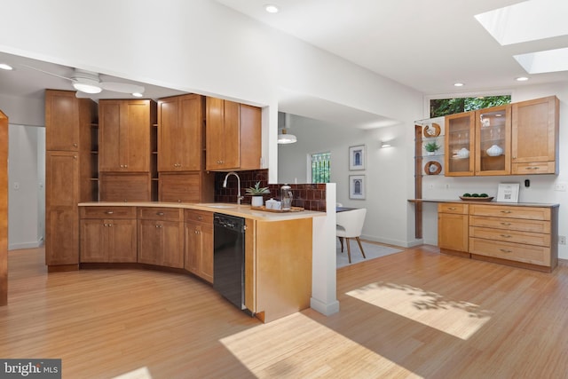 4834 8th St S, Arlington, VA 22204 - kitchen featuring dishwasher, a sink, a skylight, light wood-style floors, and recessed lighting
