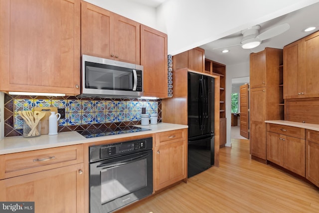 4834 8th St S, Arlington, VA 22204 - kitchen with black appliances, light wood finished floors, decorative backsplash, open shelves, and light countertops