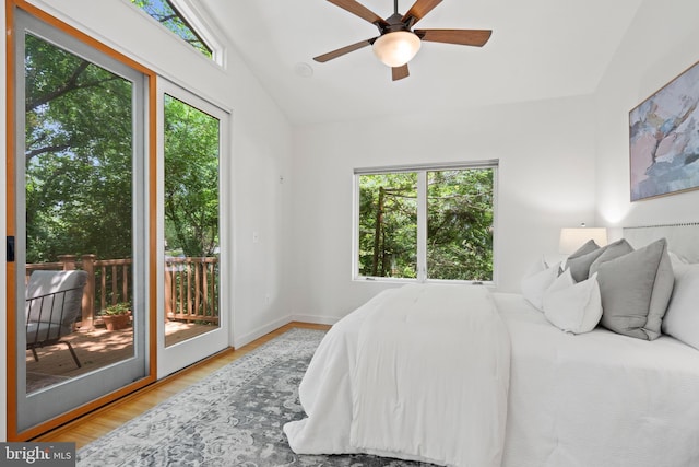 4834 8th St S, Arlington, VA 22204 - bedroom with multiple windows, access to exterior, wood finished floors, and baseboards