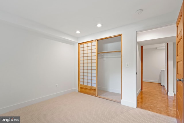 4834 8th St S, Arlington, VA 22204 - unfurnished bedroom with a closet, light colored carpet, recessed lighting, and baseboards
