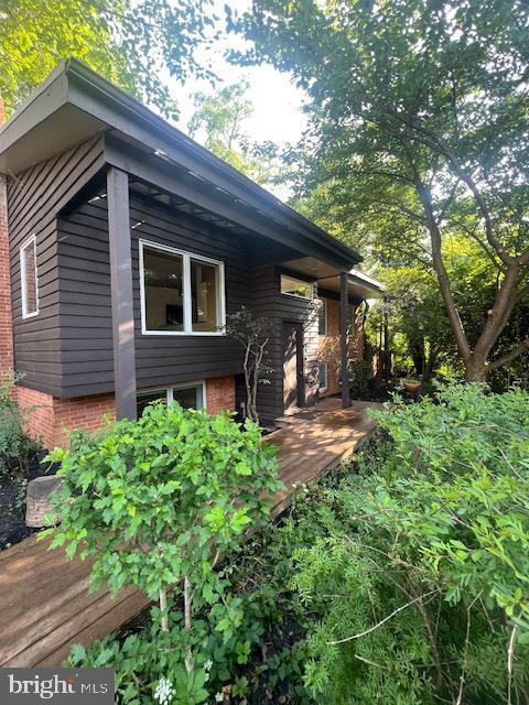 4834 8th St S, Arlington, VA 22204 - view of home's exterior featuring a deck and brick siding