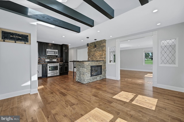 501 Clays Ln, Laurel, MD 20707 - unfurnished living room with wood finished floors, recessed lighting, a fireplace, and baseboards