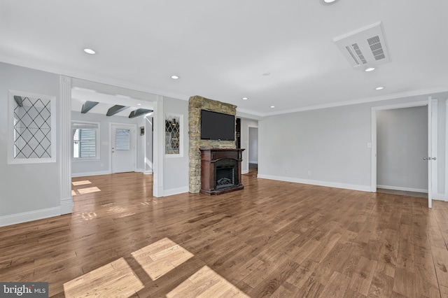 501 Clays Ln, Laurel, MD 20707 - unfurnished living room featuring a stone fireplace, wood finished floors, crown molding, baseboards, and recessed lighting