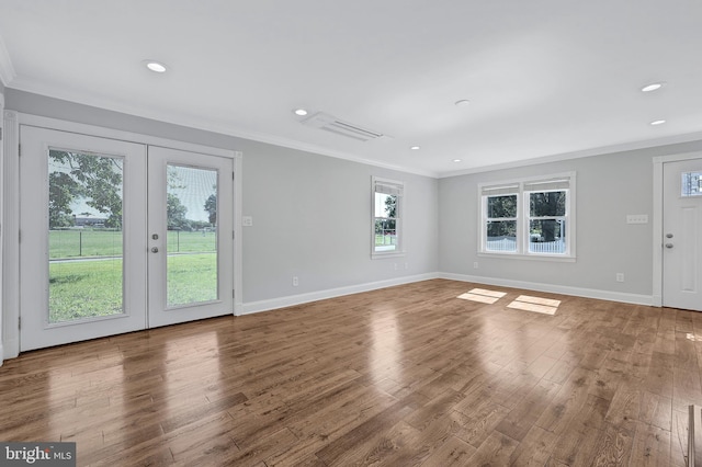 501 Clays Ln, Laurel, MD 20707 - unfurnished living room with crown molding, healthy amount of natural light, wood finished floors, french doors, and recessed lighting