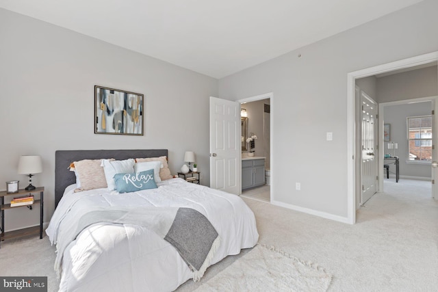 8311 Cloud St, Laurel, MD 20724 - bedroom with light colored carpet, baseboards, and connected bathroom