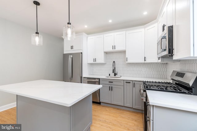 2112 Pine St Unit 2, Philadelphia, PA 19103 - kitchen with appliances with stainless steel finishes, a sink, gray cabinets, backsplash, and recessed lighting