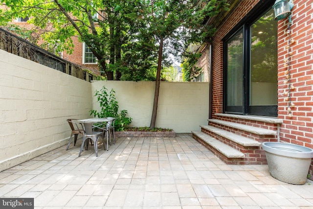 2112 Pine St Unit 2, Philadelphia, PA 19103 - fenced backyard with entry steps, a patio, and outdoor dining space