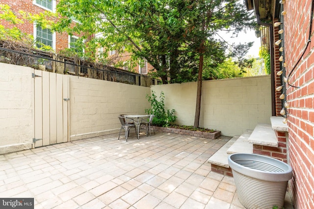 2112 Pine St Unit 2, Philadelphia, PA 19103 - fenced backyard with a patio, outdoor dining space, and a gate