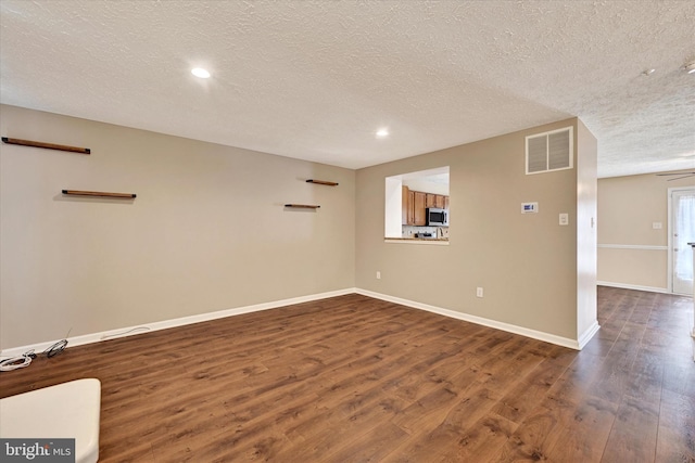 6119 Starburn Path, Columbia, MD 21045 - unfurnished room featuring dark wood-type flooring, a textured ceiling, and recessed lighting